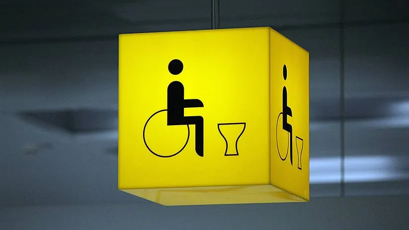 Un panneau de signalisation pour les personnes handicapées